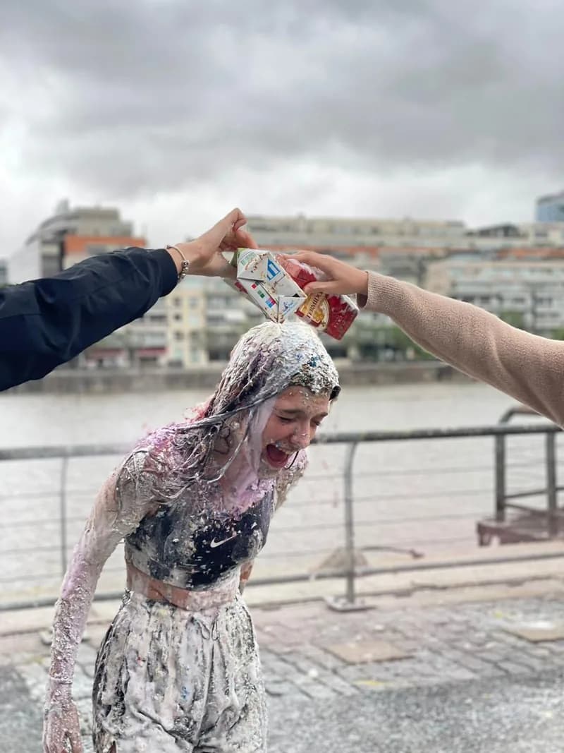 Pili covered in flour and paint, celebrating her graduation.